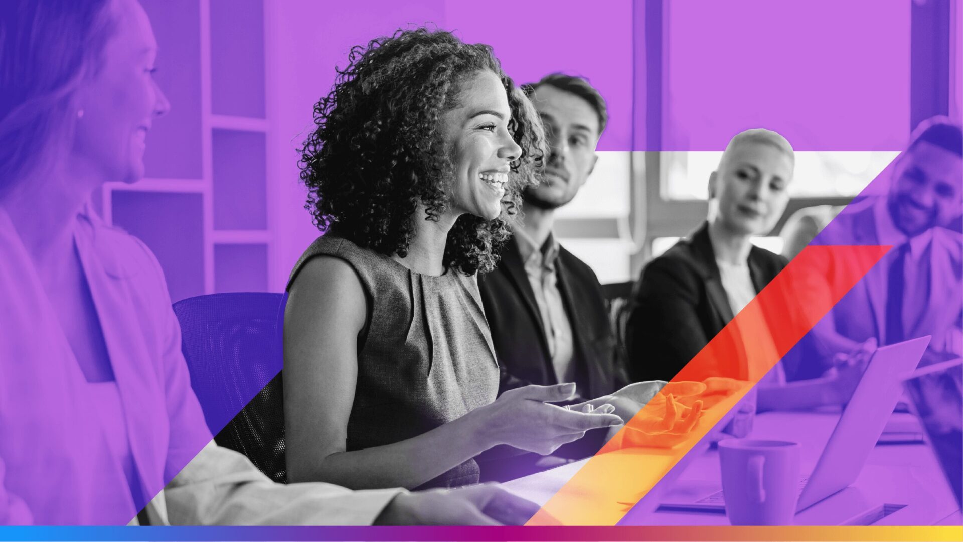 image of a group of coworkers around a conference table - used as featured image for the award-winning email campaigns article