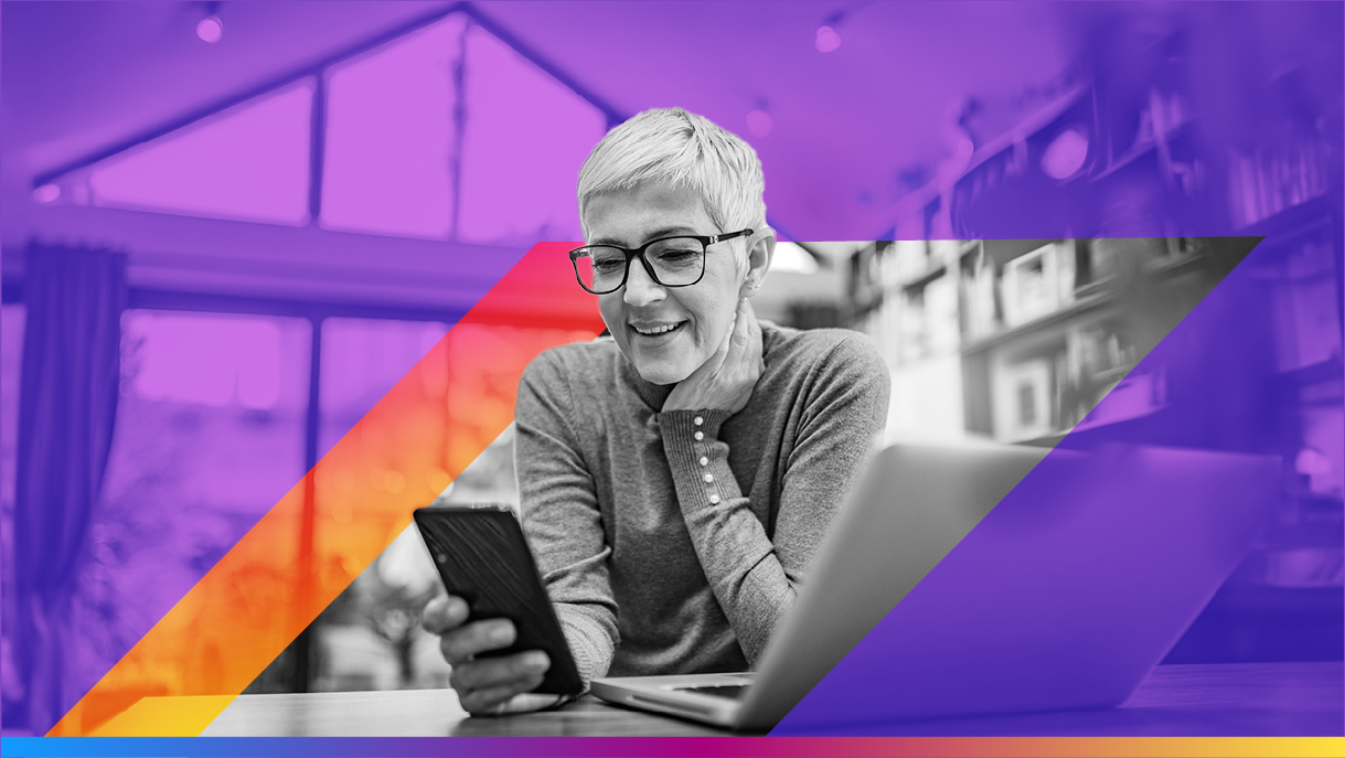 Person looking at their phone and smiling